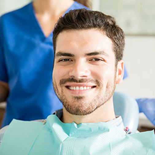 Young man smiling in the dental chair