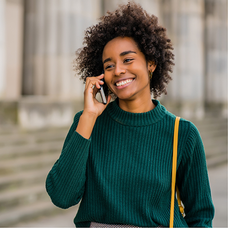 Perosn using their phone to call a dental office in Rogers