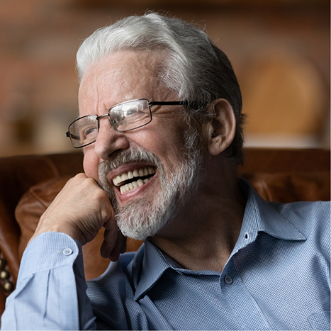 Senior man smiling with dental implants in Rogers