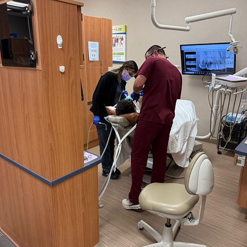 Dental patient receiving a treatment