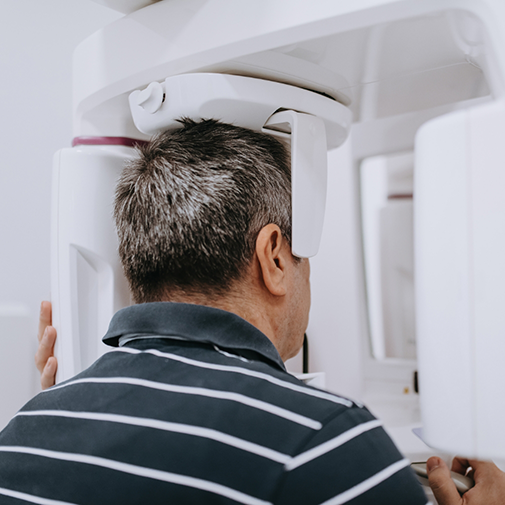 Man getting a CT cone beam scan of his mouth and jaws