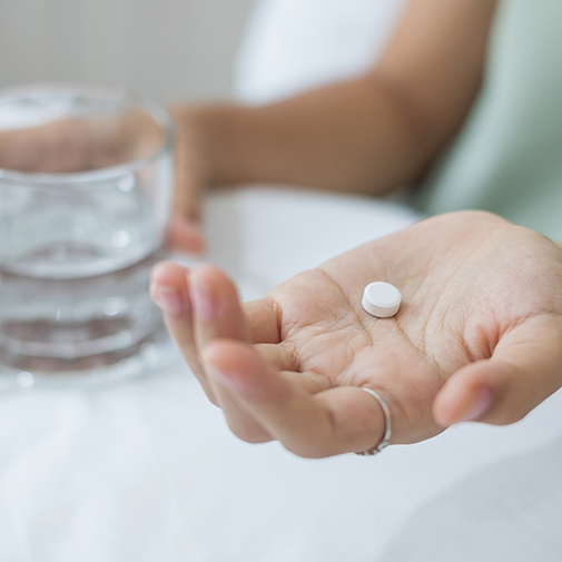 Person taking a pill