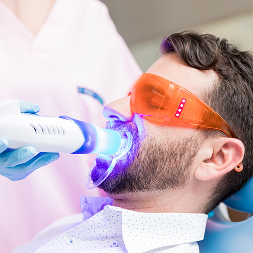 Dental patient getting professional teeth whitening