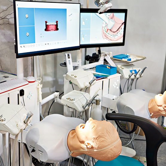Practice dental patient treatment stations at a dental training facility