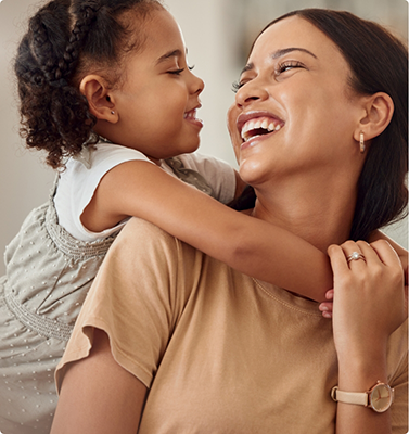Mother holding her young daughter