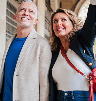 Older couple walking outside and pointing to something out of view