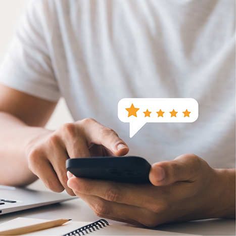 Person leaving a five star review on their phone